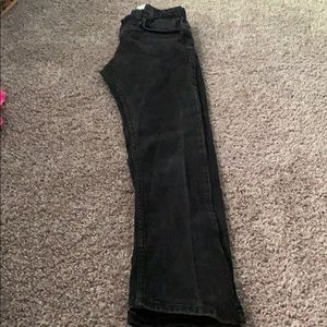 Distressed black girls Levi 511 jeans